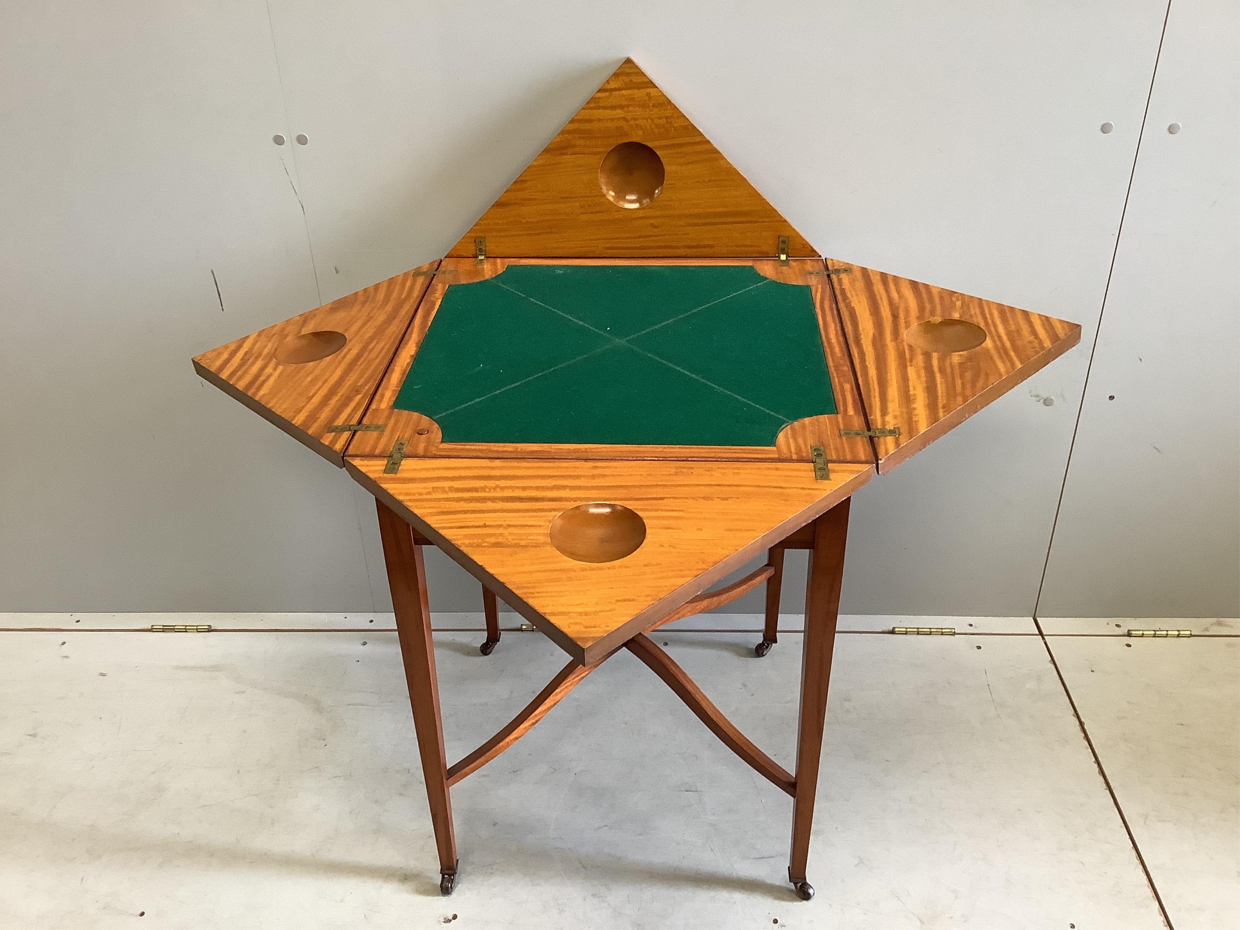 An Edwardian banded satinwood envelope card table, width 56cm, depth 56cm, height 76cm. Condition - good